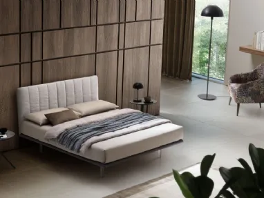 Bed with Celine fabric headboard by Le Comfort.