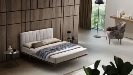 Bed with Celine fabric headboard by Le Comfort.