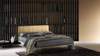 Leather bed with quilted headboard and transparent Clever feet by Bside.