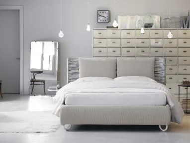 Double bed upholstered with Hug 01 Pillows by Noctis.