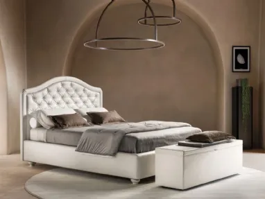 Bed in eco-leather with shaped and quilted Infinity headboard by Bside.