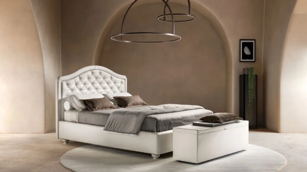 Bed in eco-leather with shaped and quilted Infinity headboard by Bside.