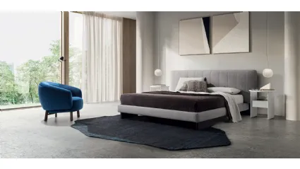 Kilian upholstered bed with quilted headboard by Calligaris.