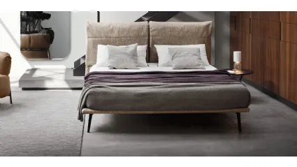 Fabric bed with Landa headboard by Calligaris.