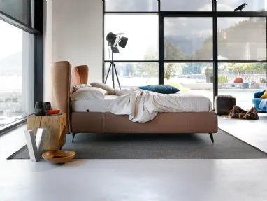 Leonte upholstered bed with curved headboard by Noctis.