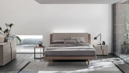 Bed in textured amber walnut and textured cement with Roxy headboard by Tomasella.