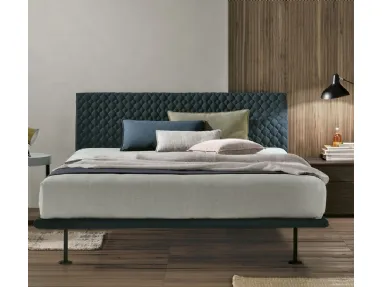 Seven Plus bed with quilted headboard by Tomasella