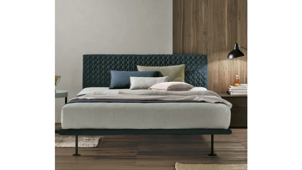 Seven Plus bed with quilted headboard by Tomasella