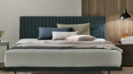 Seven Plus bed with quilted headboard by Tomasella