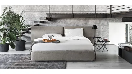 Upholstered fabric bed with Calligaris Zip headboard.