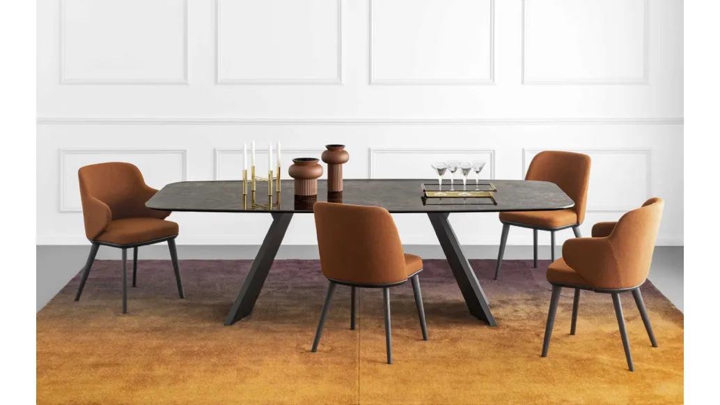 Icaro elliptical table with ceramic top and wooden base veneered by Calligaris.