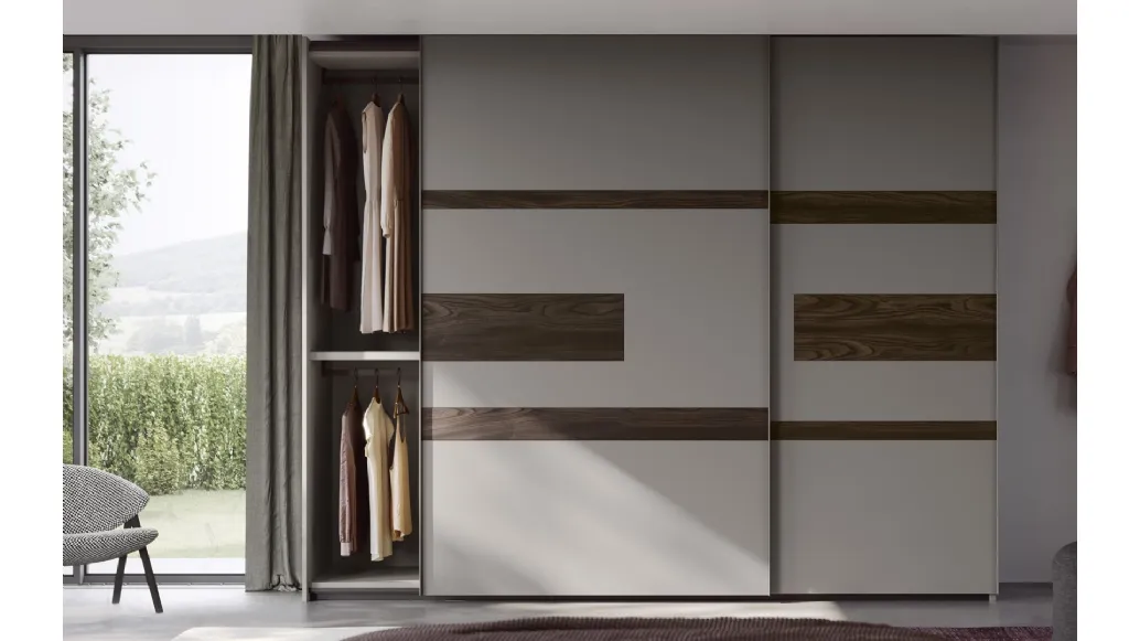 Wardrobe with sliding doors and Emotion TV unit by Fimar.